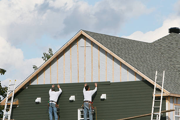 Professional Siding technician working in North Beach, MD